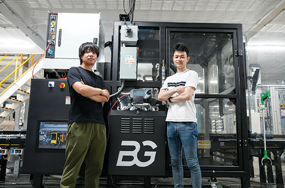 Masashi Okabe (left), project manager and production engineer, and Taro Ito, robot QCQA lead, SoftBank Robotics.