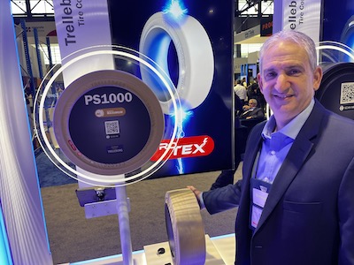 <p>Trelleborg’s Marc Margossian points out the PS1000 tire featuring the company’s ProTEX compound, which enhances safety in flammable and explosive environments.</p>