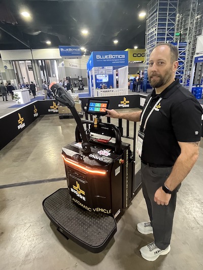 The Big Joe lineup includes autonomous units such as this one with a simple on-board
flat screen to manage missions, while ePicker’s focus is on purpose-built lithium units. Pictured
with the Big Joe autonomous unit is Nick Malewicki, GM of Big Joe’s autonomous division.