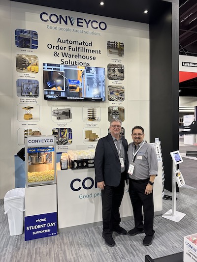From left, Brian Keiger, vice president of sales, and Ed Romaine, vice president of marketing & business development, for Conveyco present their wall of solutions.
