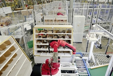 A Covariant robotic put wall solution autonomously sorting items.