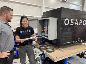 Mission Project Manager Kory Boswell (left) and OSARO Solutions Engineer Nina Haas (right) confer on a project at Mission’s headquarters in Michigan.