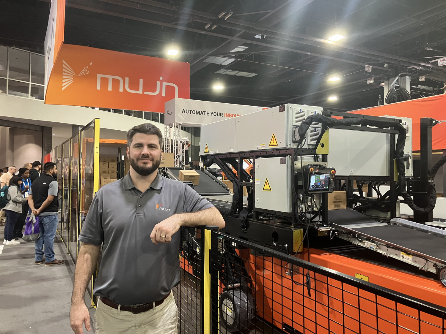 Mujin's director of sales, Josh Cloer, showcases the company's TruckBot, an autonomous unloader. 