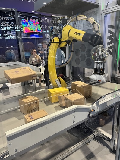 This demo at the Zivid booth showcased a solution from integrator AWL, doing robotic singulation of randomly presented parcels, tapping AI/vision software from Fizyr.