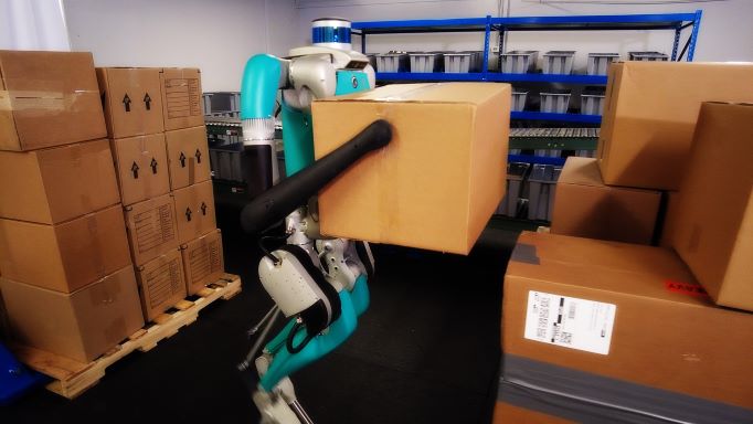 Digit, Agility Robotics’ robot, moving packages