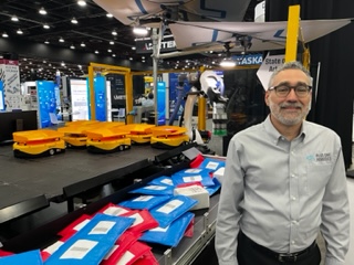 Erik Nieves, founder of Plus One Robotics, at Automate 2022. The booth’s demo featured an integrated solution combining one of Plus One’s cells with mobile sortation robots from Tompkins Robotics.
