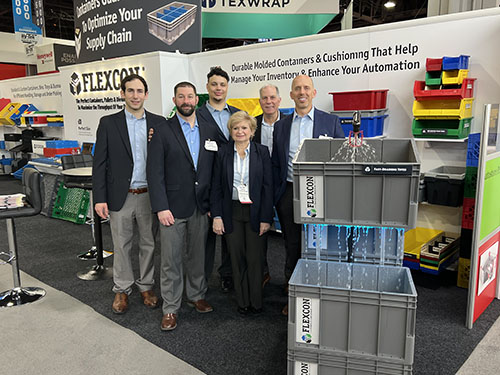 The Flexcon team with the New Quick-Drain Vented Tote. 