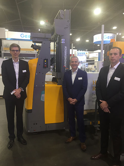 Kai Beckhaus, president of MCJ Supply Chain Solutions; John Sneddon, executive VP, sales and marketing for Mitsubishi Logisnext Americas; and Timothy Harrison, director of AGV sales, North America for Jungheinrich, showcase the company’s AGV solutions.