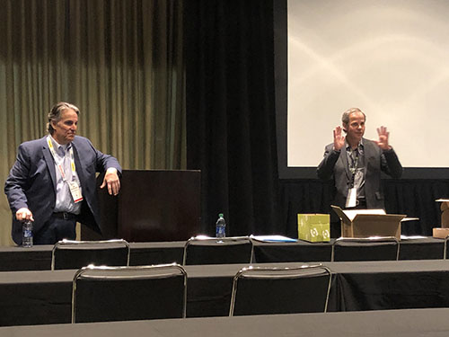 Rod Gallaway, CEO, and Hanko Kiessner, founder and executive chair, discuss Packsize International’s automated packaging solutions during a Monday press conference.