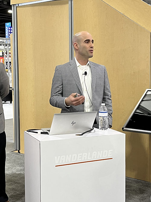 Sean Wallingford, Vanderlande’s president, Warehouse Solutions, North America, explaining the scope of innovations from the company at Tuesday’s booth press conference.