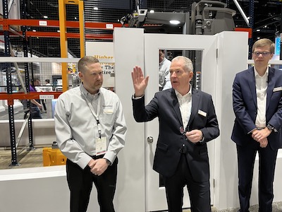 John Sneddon, EVP of sales, systems and marketing for Mitshbushi Logisnext America’s (at center) gives an overview of the Jungheinrich lift truck lineup, along with Michael Brunnet, systems truck sles manager for Logisnext (at left) and Kai Beckhaus, Logisnext’s expert on autonomous solutions (at right).