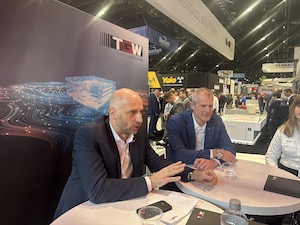 From left, Christoph Wolkerstorfer, chief sales officer at TGW Logistics, and Chad Zollman, chief sales officer, North America, discuss the future fulfillment center