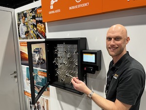 Craig Newell, VP of business development with Traka Americas, shows one of the company’s intelligent key cabinets.