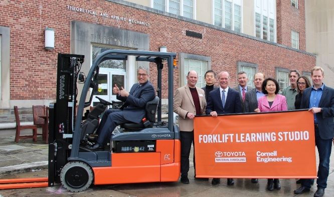 Pictured (L-R): Brian Kirby (on forklift), the Meinig Family Professor of Engineering in Cornell’s Sibley School of Mechanical and Aerospace Engineering (MAE); David Putnam, Cornell Engineering’s Associate Dean for Innovation and Entrepreneurship; Yong Joo, Cornell Engineering’s Senior Associate Dean for Masters of Engineering Programs; Brett Wood, President & CEO of Toyota Material Handling North America; Dave Schneckenburger, CEO, Thompson & Johnson Equipment Co.; Mark Faiman, Toyota Material Handling Product Planning Manager; Grace Xing, Cornell Engineering’s Associate Dean for Research and Graduate Studies; Matt Ulinski, MAE’s Master’s of Engineering Program Director; Perrine Pepiot, MAE’s Director of Graduate Studies; David Erickson, MAE’s S.C. Thomas Sze Director.